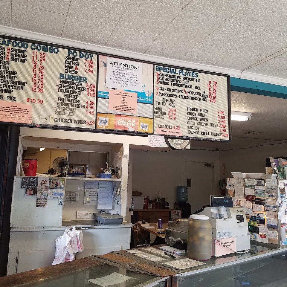 Printed seafood menu with lunch and dinner items.